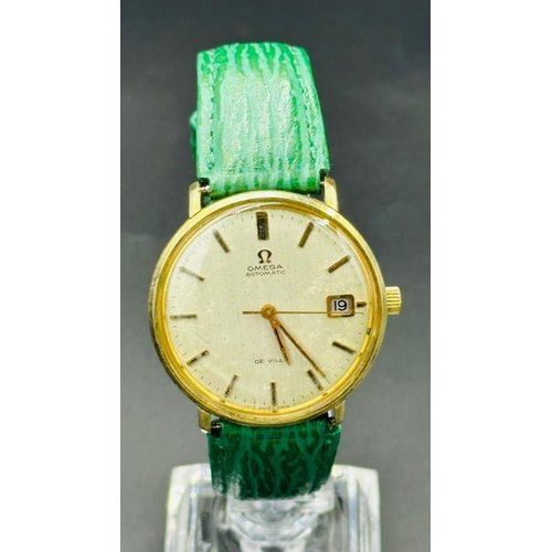 737 - An Omega Automatic De Ville wristwatch on green leather strap