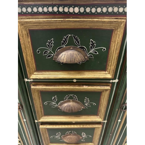 81 - A rustic green and florally painted cupboard with four short drawers to centre and flanked by cupboa... 