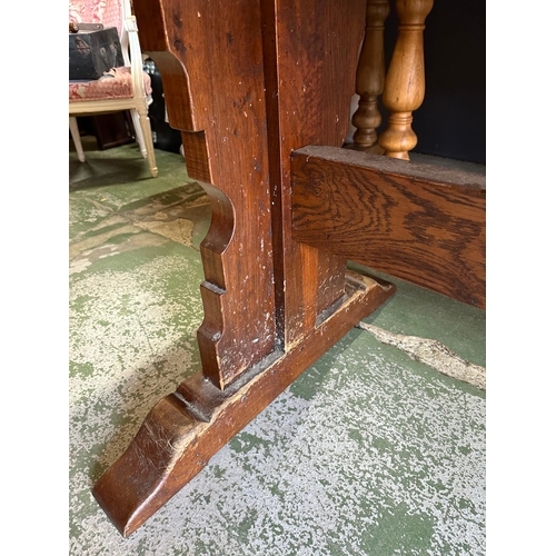 67 - A large oak three plank refectory table on carved legs with pegged cross stretcher by Batesy Lamborn... 