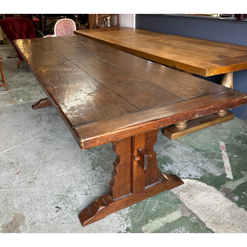 67 - A large oak three plank refectory table on carved legs with pegged cross stretcher by Batesy Lamborn... 