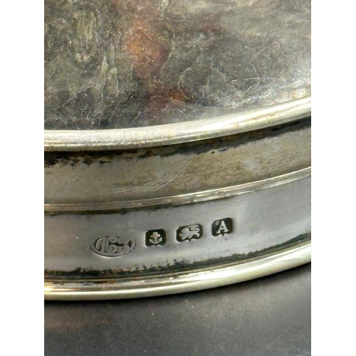 11 - A silver and tortoiseshell pot lid by 	Alexander Clark & Co Ltd, hallmarked for Birmingham 1925.