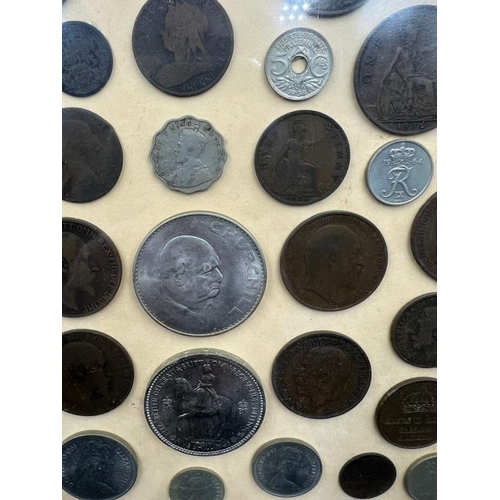 113 - A framed selection of worldwide coins