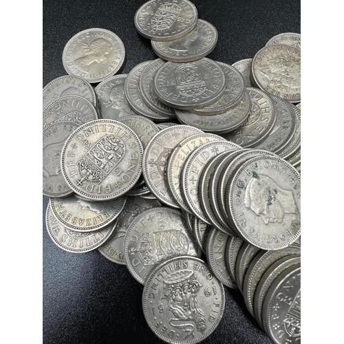 124 - A quantity of shillings including pre 1947 silver