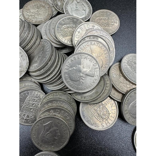 124 - A quantity of shillings including pre 1947 silver