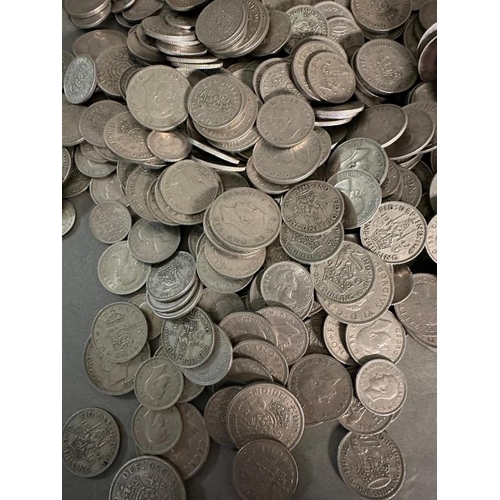 130 - A quantity of UK silver content coinage to include shillings, two shilling and six pence