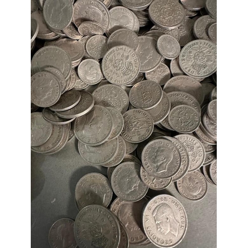 130 - A quantity of UK silver content coinage to include shillings, two shilling and six pence