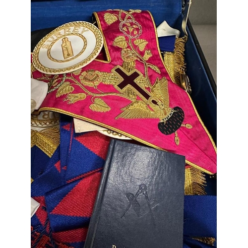 166 - A briefcase containing a selection of Masonic items to include gloves, aprons and medals