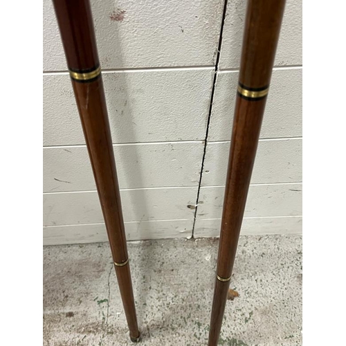 173 - A pair of walking sticks with ducks head handles both unscrewed into four parts