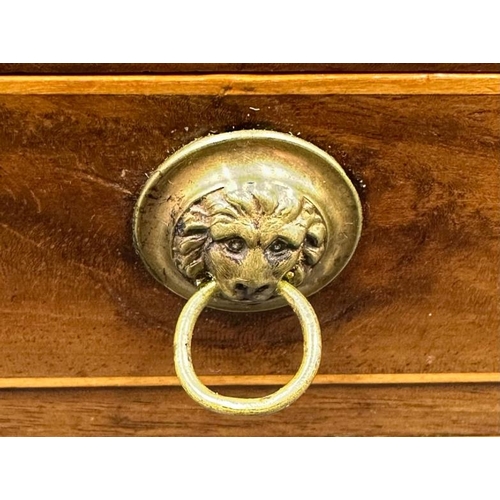 217 - A Georgian Regency inlaid and cross banded work box of Sarcophagus form with lion mask brass ring dr... 