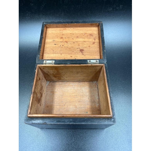 26 - A wooden cigarette box with hallmarked silver fitments.