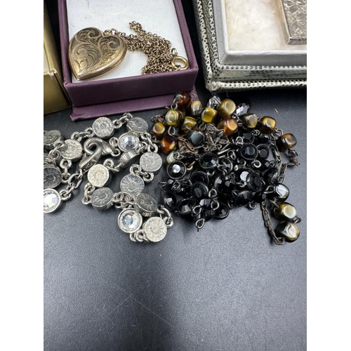 51 - A selection of costume jewellery to include a silver cross hallmarked for Birmingham 1908 makers mar... 