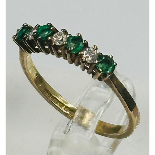 62 - A 9ct gold emerald and diamond style ring, approximate size M.5