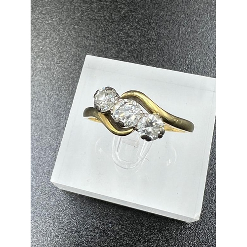 73 - Antique style three stone diamond ring with a later London hallmark, centre stone 0.45ct, side stone... 