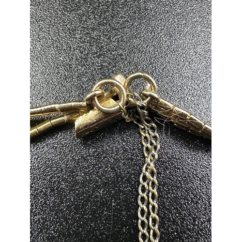 68A - An 18ct yellow gold two strand bracelet with an approximate weight of 13.8g, marked 750