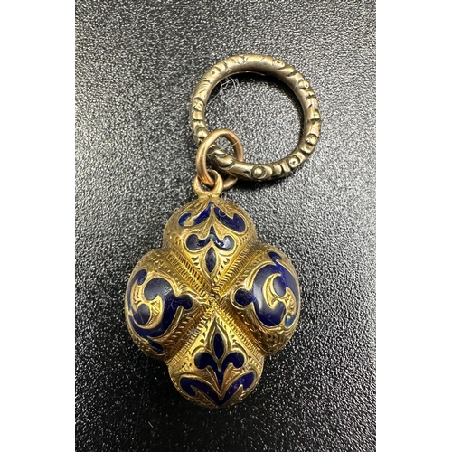 68C - A yellow metal and blue enamel remembrance locket with plaited hair