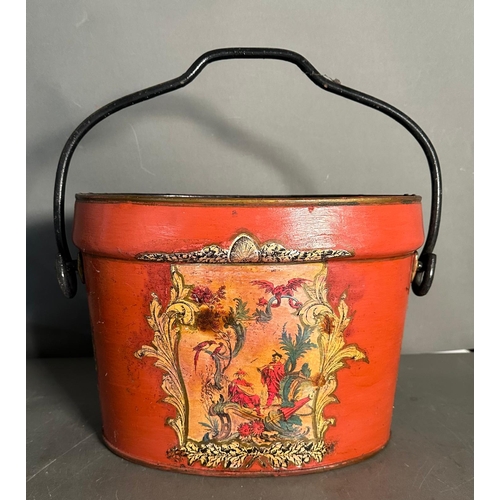 214A - A Chinoises metal bucket, red grounds and with a pastoral fare Eastern scene