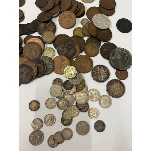 132B - A selection of Uk coinage, some silver content, six pence and three pennies along with Victorian and... 