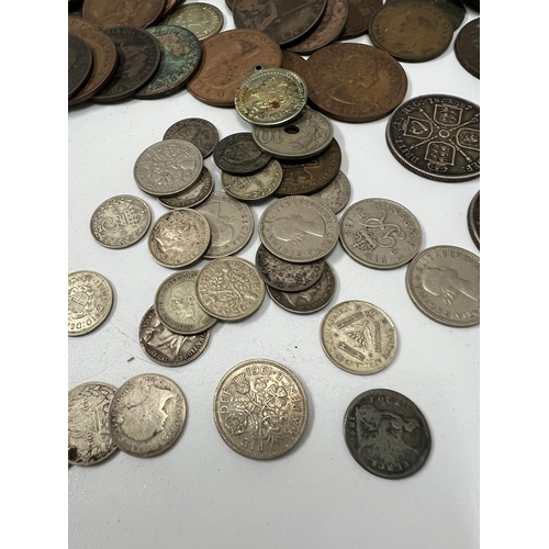 132B - A selection of Uk coinage, some silver content, six pence and three pennies along with Victorian and... 