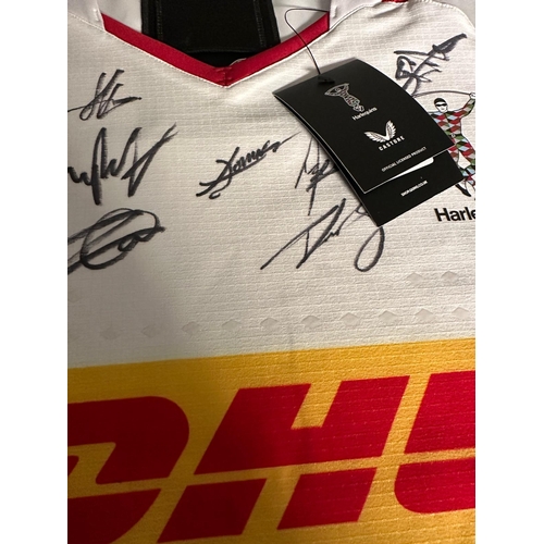 184A - A Harlequins rugby shirt signed by current players and staff with accompanying C.O.A. The proceeds o... 