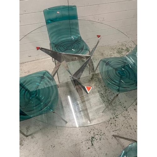 100 - L'eau chairs, metal frame and transparent wave technopoymer shell seat with a glass dining table on ... 