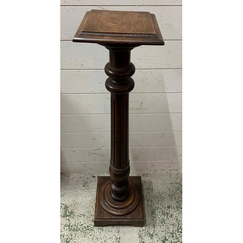 111 - Victorian torchiere turned pedestal on a square base (H102cm)