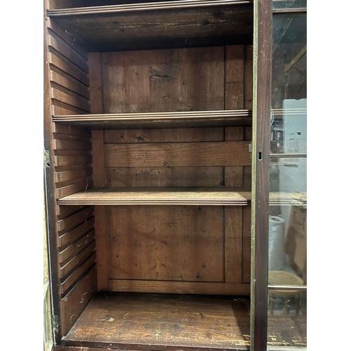 116 - A mahogany secretaire bookcase with glazed doors