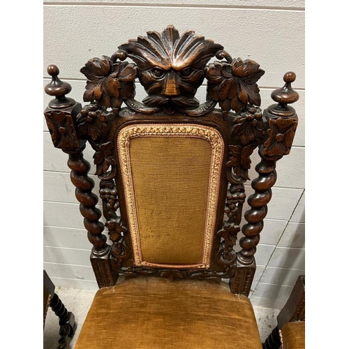 117 - A carved solid oak dining chairs