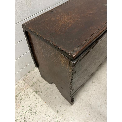 129 - An oak coffer, single plank top opening to reveal interior with a candle box and raised feet (H57cm ... 