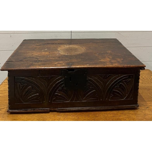 137 - An oak carved bible box (H24cm W66cm D40cm)