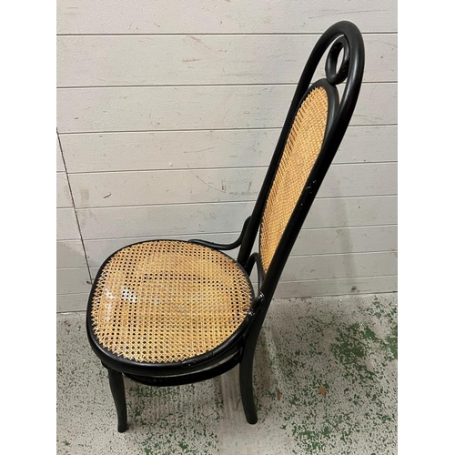 139 - A Bentwood ebonised cane seat and back chair stamped THONET