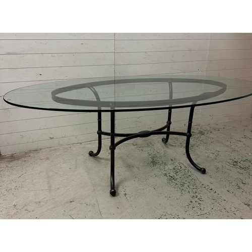 143 - A wrought iron framed glass topped table (220cm x 120cm x 77cm)