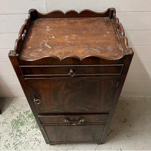 147 - A mahogany bedside cabinet, gallery top with hand cut outs opening to slide pull out stand and cupbo... 