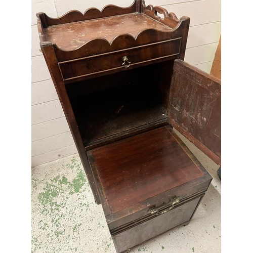 147 - A mahogany bedside cabinet, gallery top with hand cut outs opening to slide pull out stand and cupbo... 