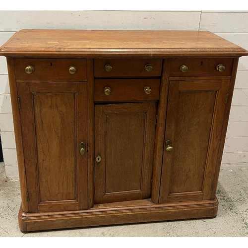 152 - A side cabinet with four short drawers flanked by two long cupboards and one central cupboard (H100c... 