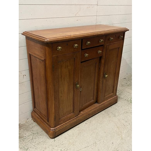 152 - A side cabinet with four short drawers flanked by two long cupboards and one central cupboard (H100c... 