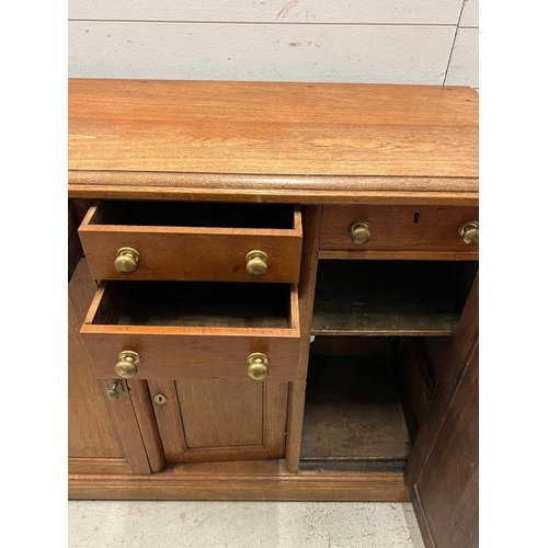 152 - A side cabinet with four short drawers flanked by two long cupboards and one central cupboard (H100c... 