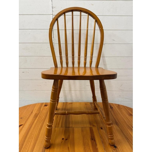 161 - A pine extendable kitchen table and two stick back chairs (H76cm W138cm D78cm)