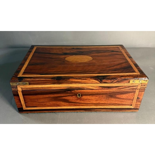 167 - A coromandel wood campaign style box with brass handles and black central escutcheon