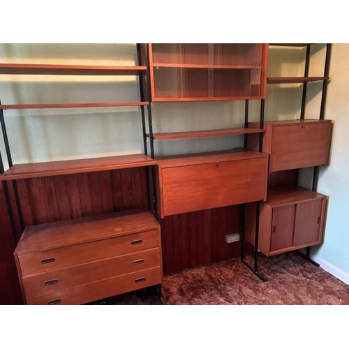 174 - A Mid Century ladderax style three piece wall unit with drawers, cupboard and a glazed unit. Height ... 