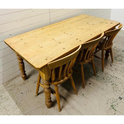 181 - A pine farmhouse table with three chairs (H78cm W183cm D86cm)