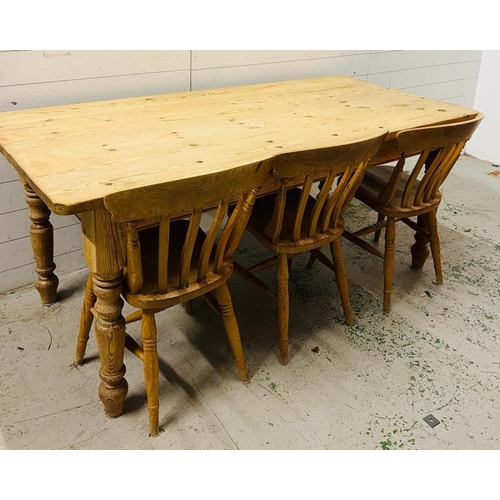 181 - A pine farmhouse table with three chairs (H78cm W183cm D86cm)