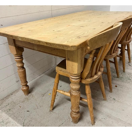 181 - A pine farmhouse table with three chairs (H78cm W183cm D86cm)