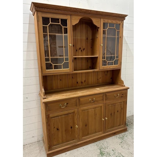 183 - A pine Welsh dresser with astragal glazed doors to top and three drawers and three cupboards under (... 