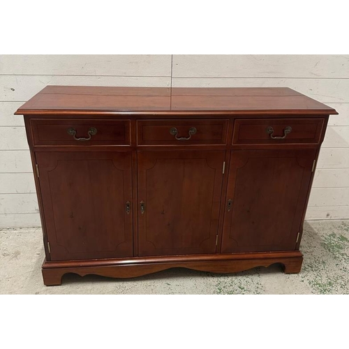 184 - A yew veneered sideboard comprising of three door cupboards and three short drawers (H82cm W120cm D4... 