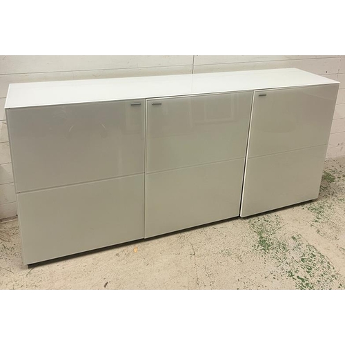 190 - A white gloss long sideboard with press close doors opening to shelves (H82cm W180cm D40cm)