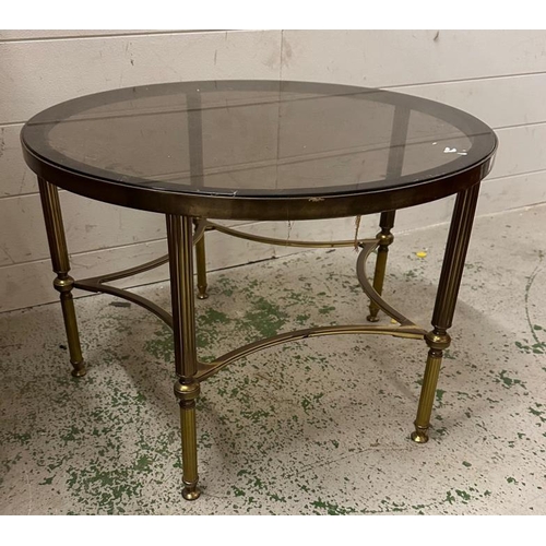 194 - A circular Mid Century brass and smoked glass coffee table  (H41cm Dia62cm)