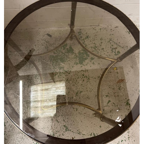 194 - A circular Mid Century brass and smoked glass coffee table  (H41cm Dia62cm)