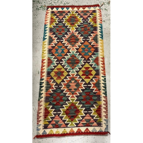 197 - Kilim rug with vibrant colour 150cm x 69cm