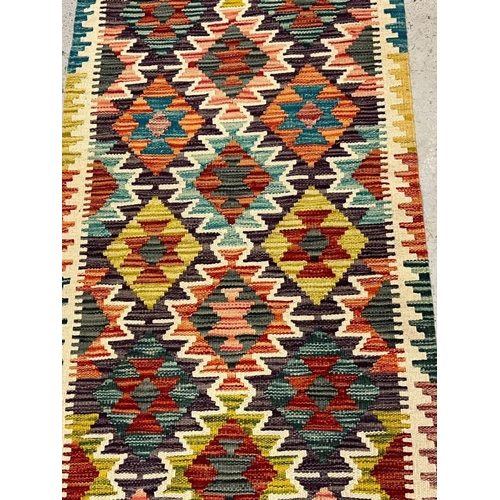 197 - Kilim rug with vibrant colour 150cm x 69cm