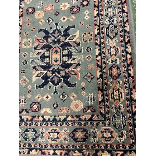 204 - A green and blue runner rug 220cm x 70cm